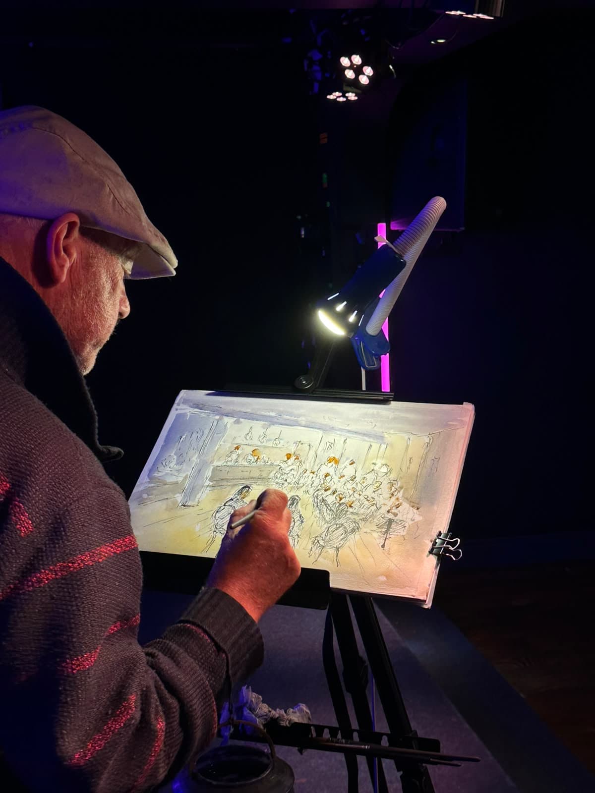 A live painting of a group, mid-session