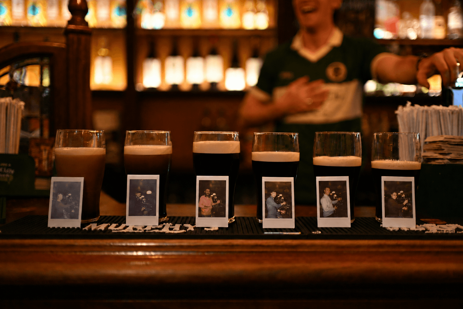 Pints of stout settling on the table with fresh Polaroids developing in front of them on a nostalgic Galway experience. Two things worth waiting for. The pint settles, the photo appears, and the night is yours to take home.